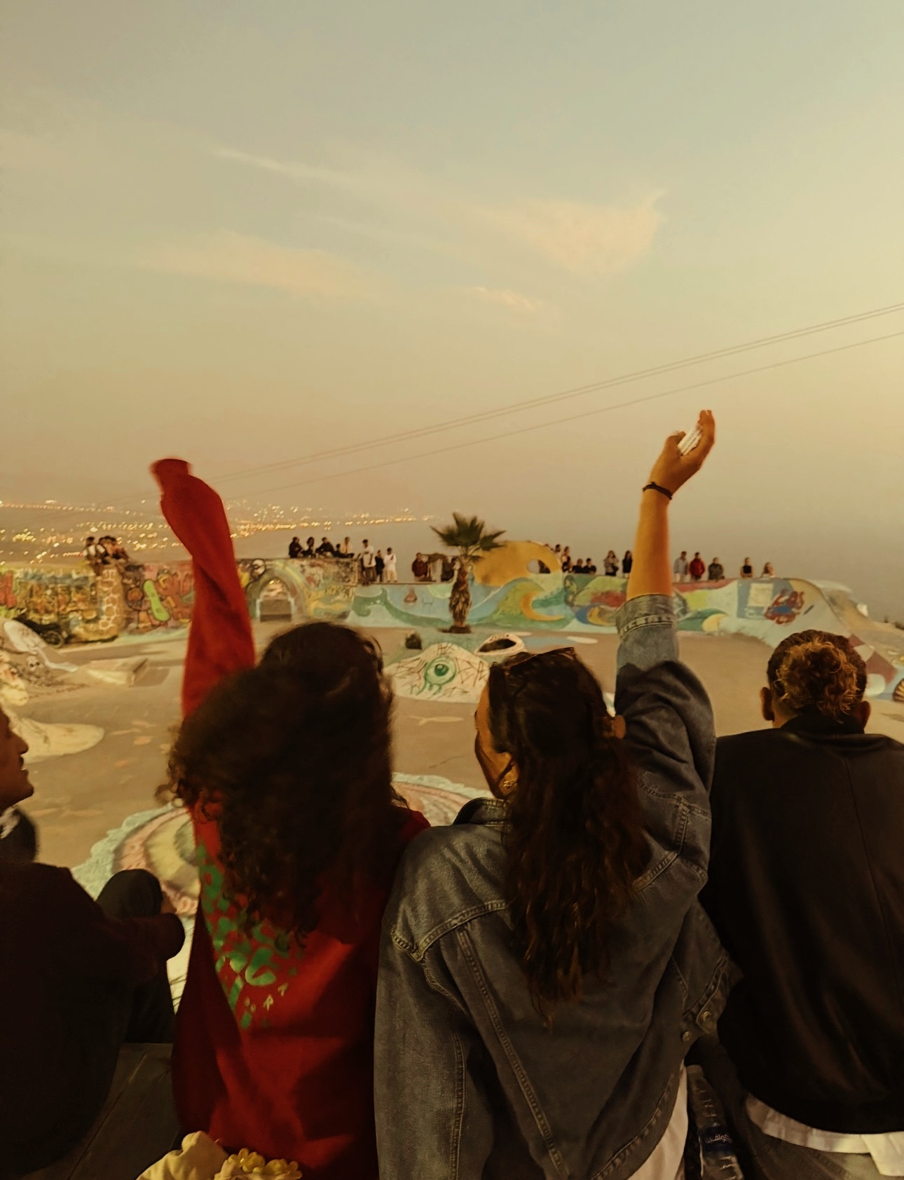 Sunset hands up over the valley